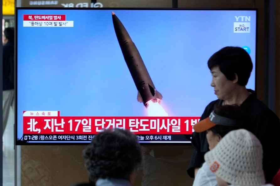 A news program broadcasts a file image of a missile launch