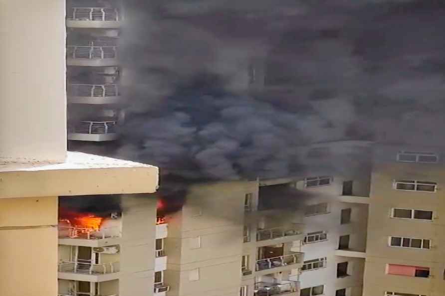 **EDS: GRAB VIA PTI VIDEO** Noida: Smoke billows out after a fire...