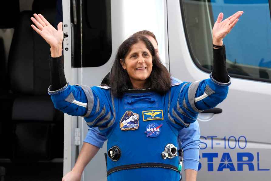 NASA astronaut Suni Williams reacts before climbing into the astro...