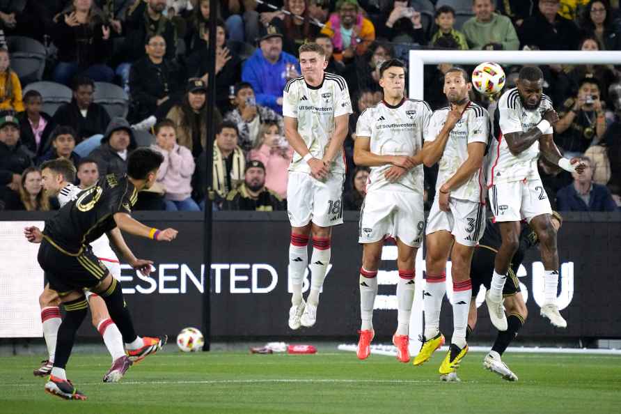 Los Angeles FC midfielder Eduard Atuesta, second from left, attempts...