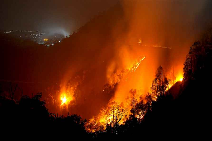 Shimla: Flames of a fire that broke out in a forest area, near Shimla...