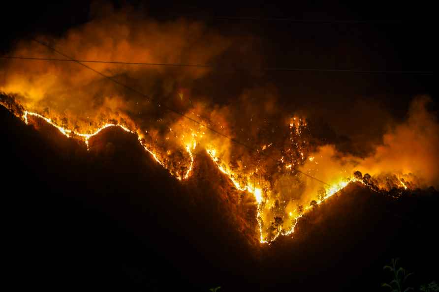 Shimla: Flames rise after a fire that broke out in a forest near...