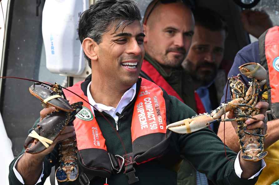 Rishi Sunak rides on a boat