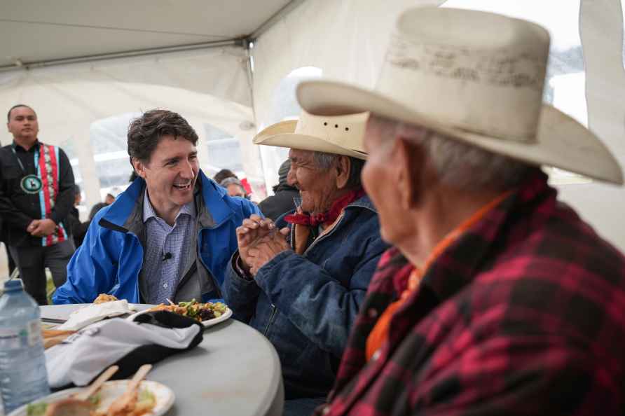 Canadian Prime Minister Justin Trudeau meets with elders while attending...