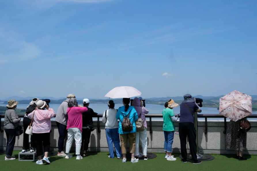 Visitors watch the North Korea side