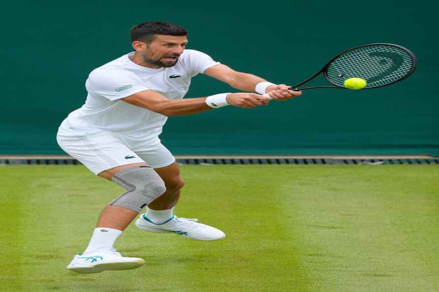 Novak Djokovic of Serbia plays a return during a training session...