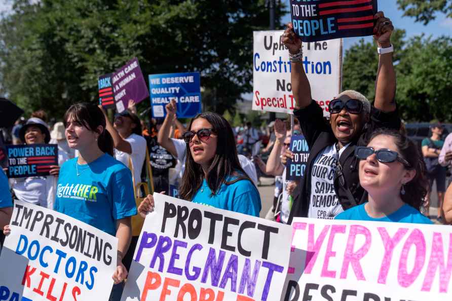 Demonstrators gather outside the Supreme Court