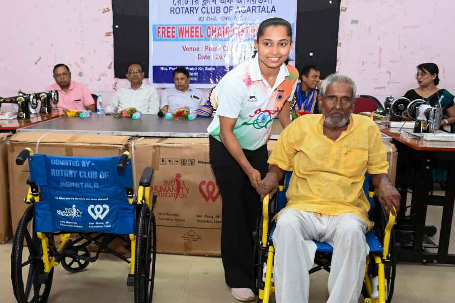 Dipa Karmakar distributes wheelchairs