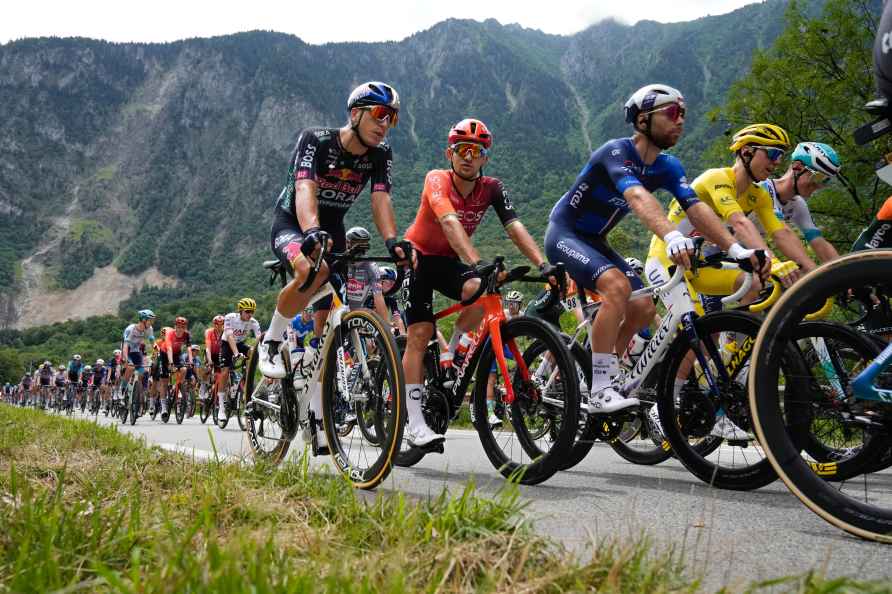 Slovenia's Tadej Pogacar, wearing the overall leader's yellow jersey...