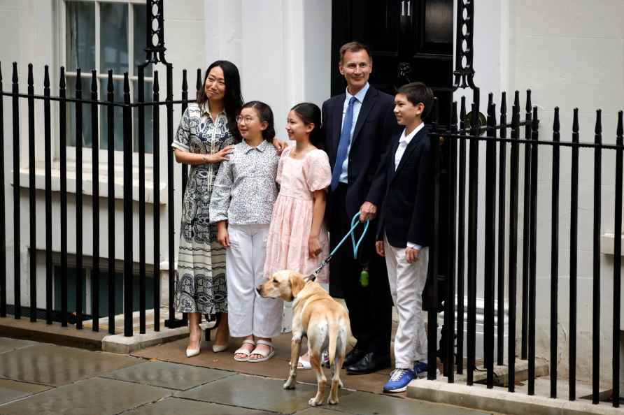 Britain's Chancellor of the Exchequer Jeremy Hunt, second right, ...