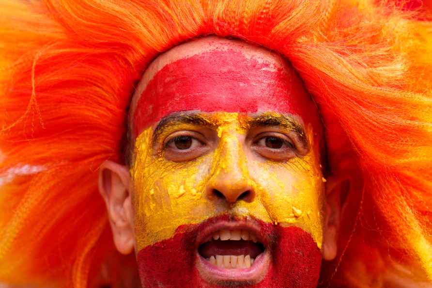 A fan cheers before a quarter final match