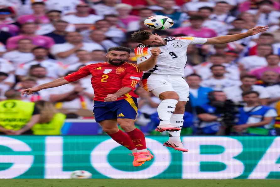 Spain's Dani Carvajal, left, challenges Germany's Niclas Fuellkrug...