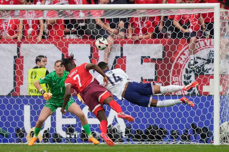 England's Ezri Konsa, left, and Switzerland's Breel Embolo vie for...