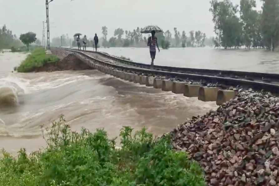 Ground washed away, rail track hangs in air