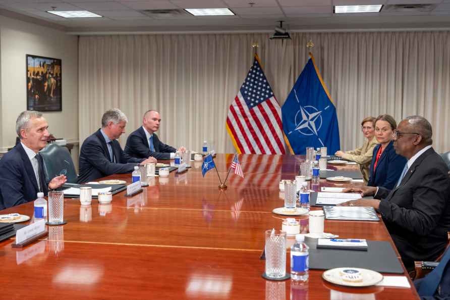 Defense Secretary Lloyd Austin, right, meets with NATO Secretary...