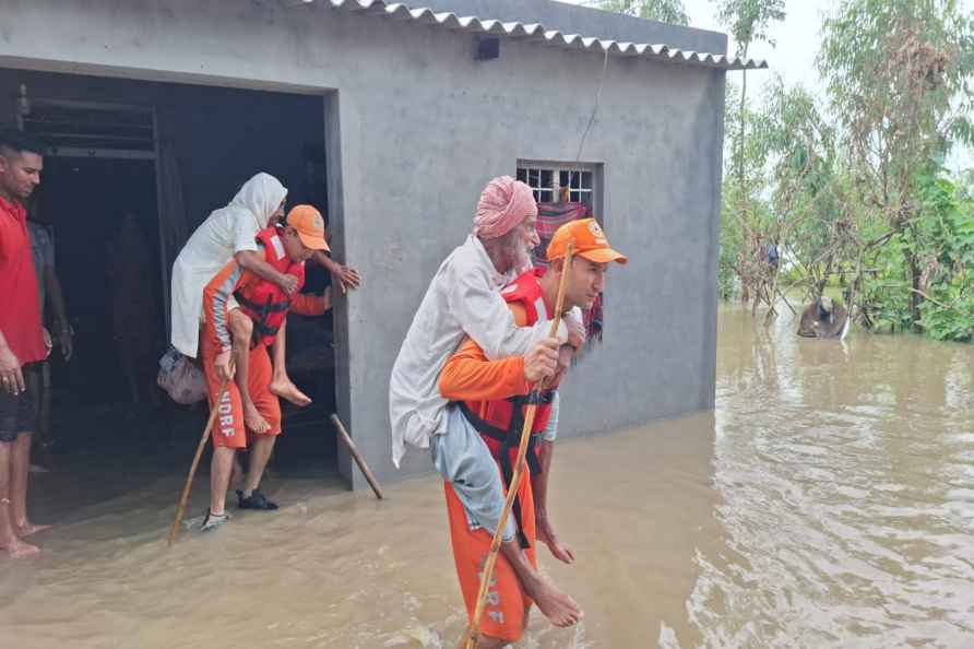 NDRF personnel rescue people from flood affected areas