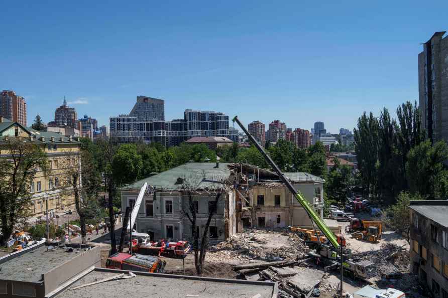 Rescue workers clear the rubble