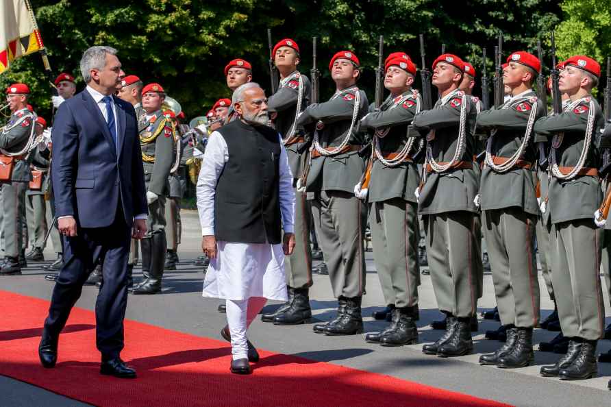 Indian Prime Minister Narendra Modi, right, is welcomed with military...