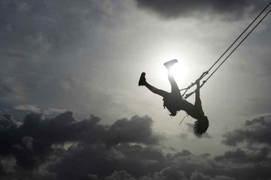 A woman swings on a swing in Venao beach