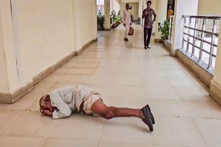 Farmer rolls on floor at collector's office