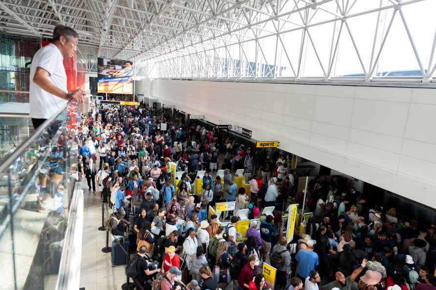 Travelers wait in line at Thurgood Marshall Airport