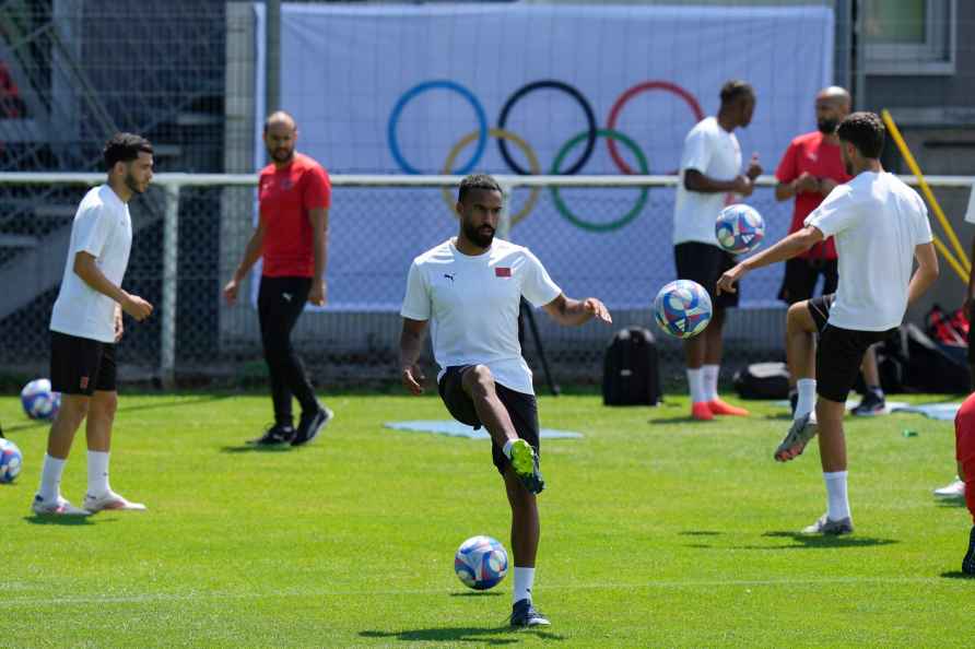 Morocco's national soccer players warm up during a training session...