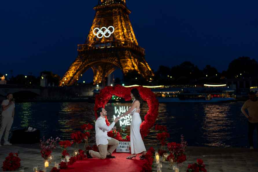 Alejandro Machuca, left, proposes to his girlfriend, Aura Guizar...