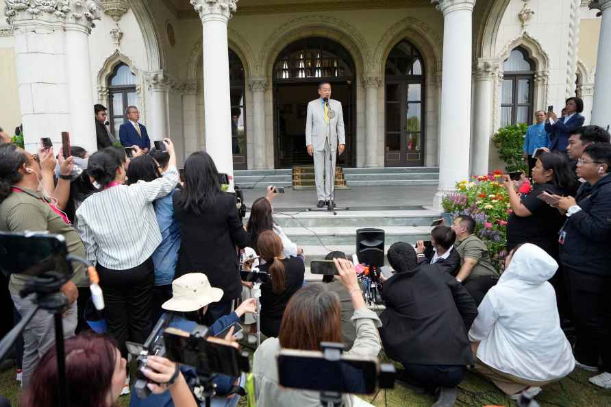 Thai Prime Minister Srettha Thavisin, center, talks to reporters...