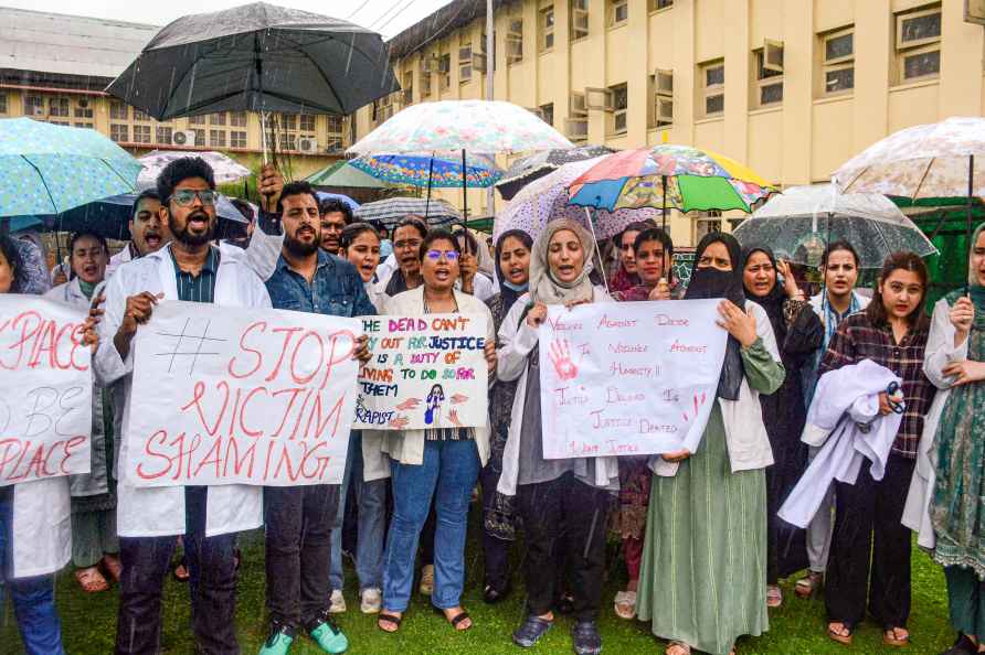 Srinagar: Doctors and medical students holding placards shout slogans...