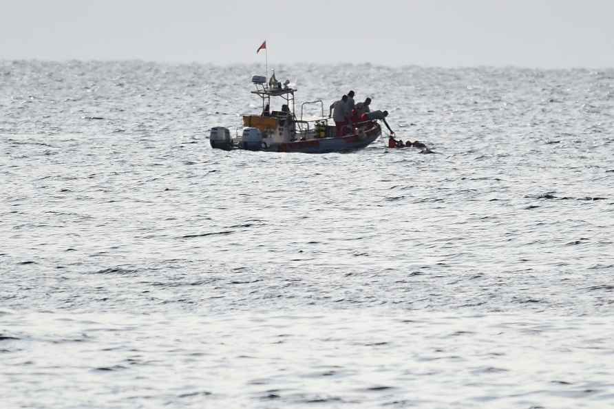 Scuba divers at the scene of the search for a missing boa