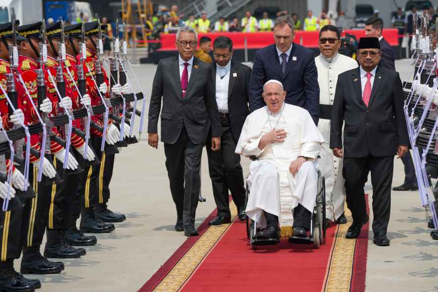 Pope Francis is taken past a guard of honour ahead of his departure...