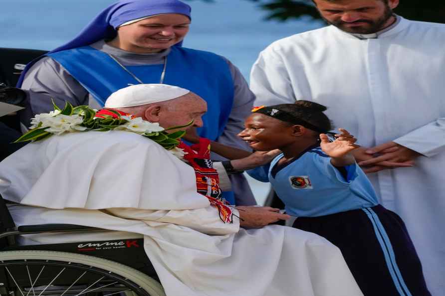 Pope Francis is hugged by a blind pupil of the Holy Trinity Humanistic...