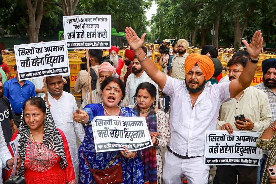 New Delhi: Members of a Sikh group stage a protest march outside...