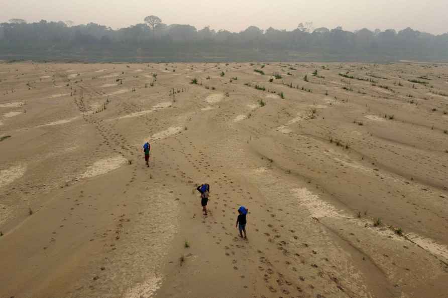 Residents transport drinking water from Humaita