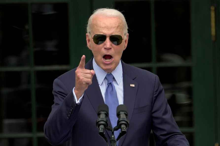 President Joe Biden speaks at a gathering on the South Lawn of the...