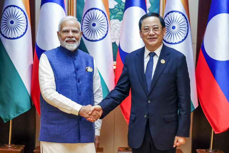 **EDS: IMAGE VIA PMO** Vientiane: Prime Minister Narendra Modi and...