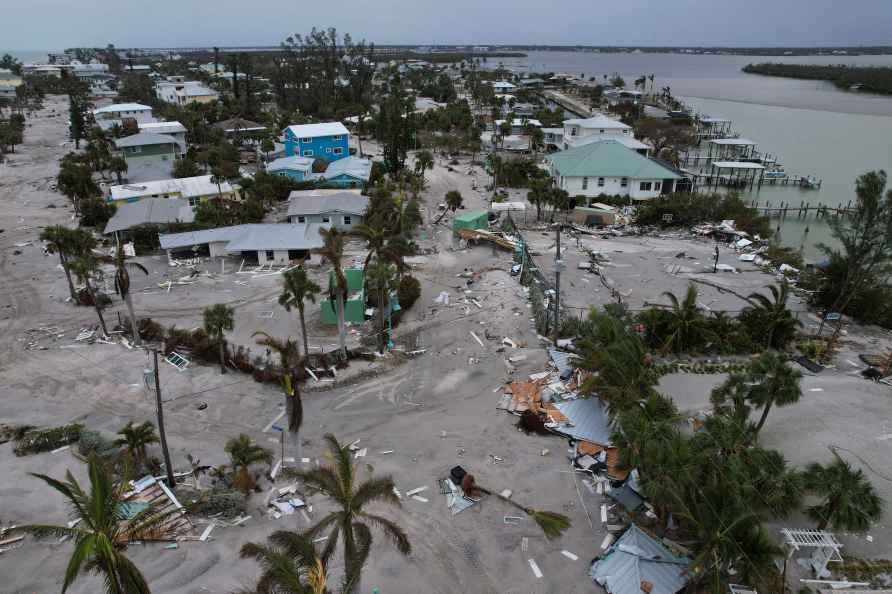 Debris lies scattered on Manasota Key, Fla., following the passage...