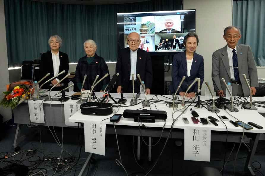 Terumi Tanaka, center, a Nihon Hidankyo executive who survived the...